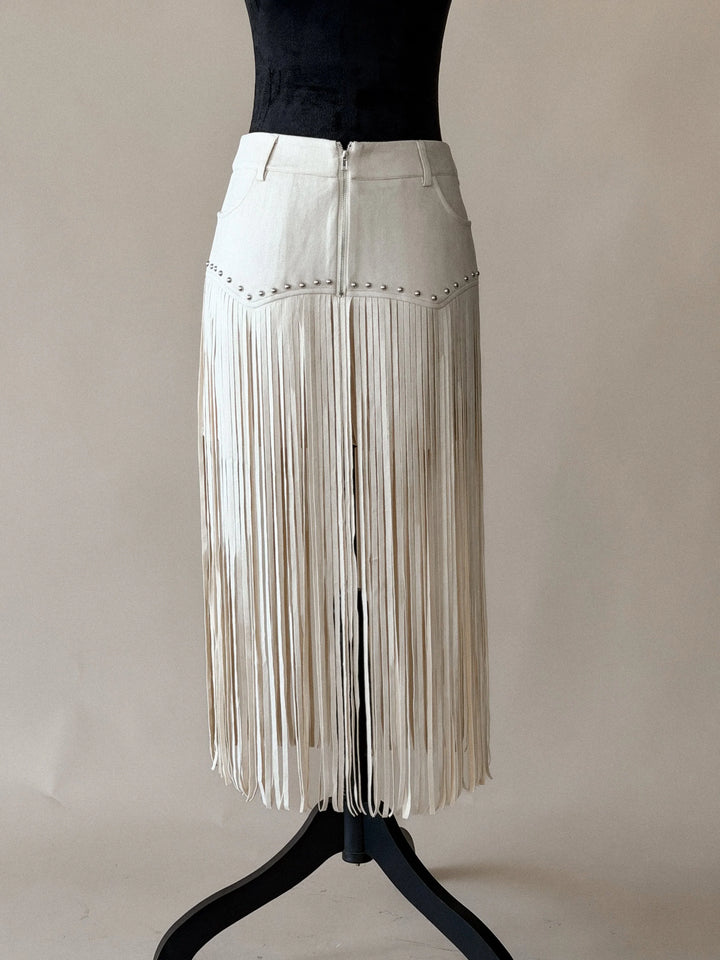 Thunderbird pendant chain necklace displayed on wooden slab with serape fabric underneath - The Wild J