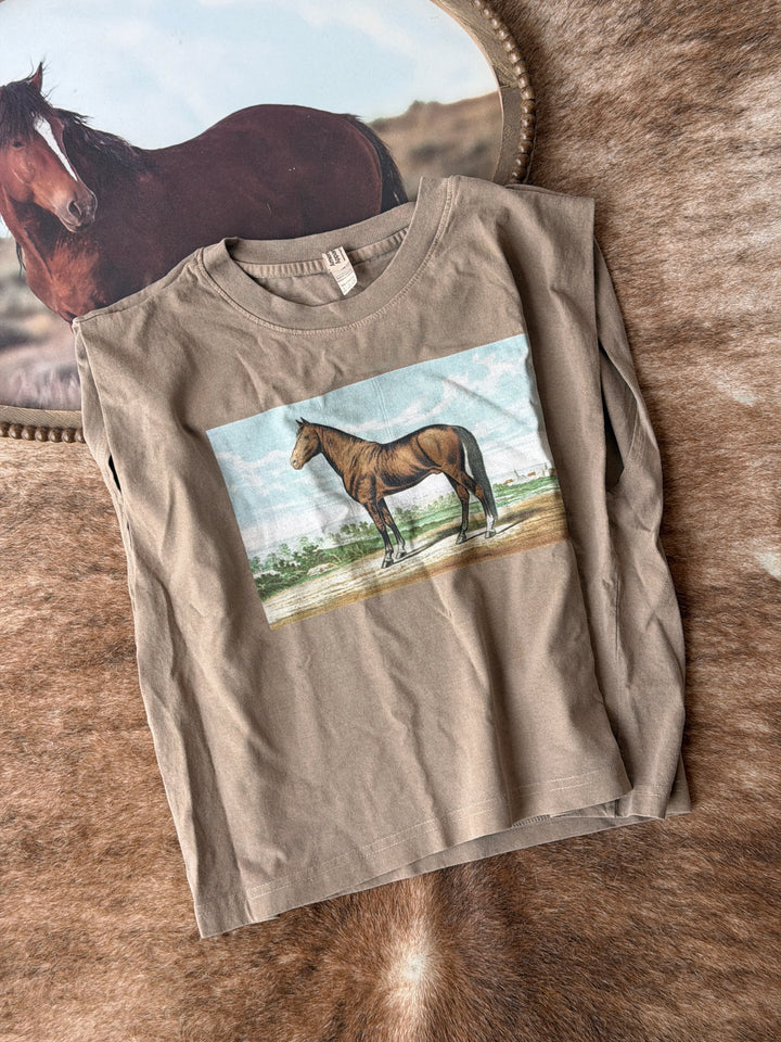 Beige t-shirt with horse graphic on a textured surface