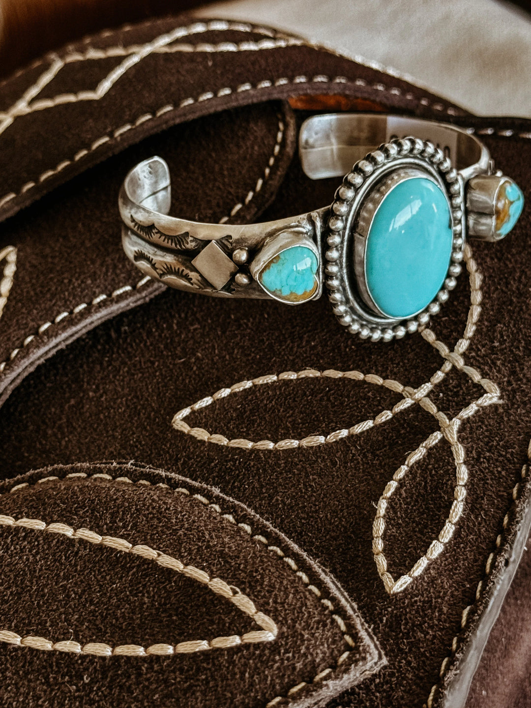 Turquoise and silver western cuff bracelet on embroidered brown suede, boho jewelry style