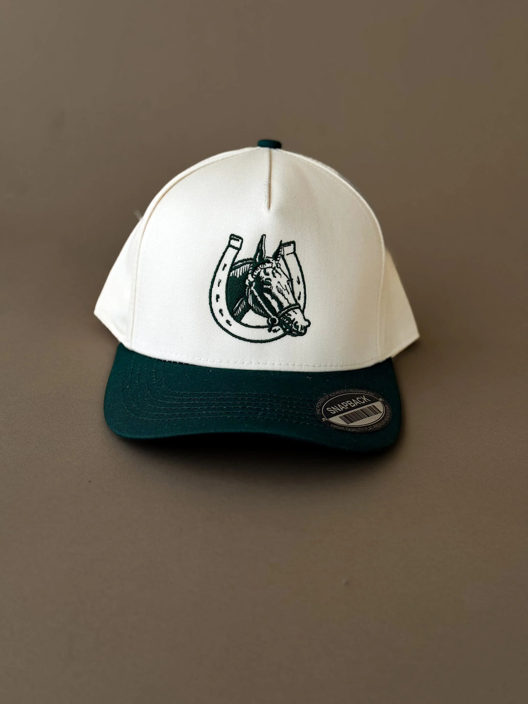Western snapback hat with horse and horseshoe embroidery, two-tone green and white design