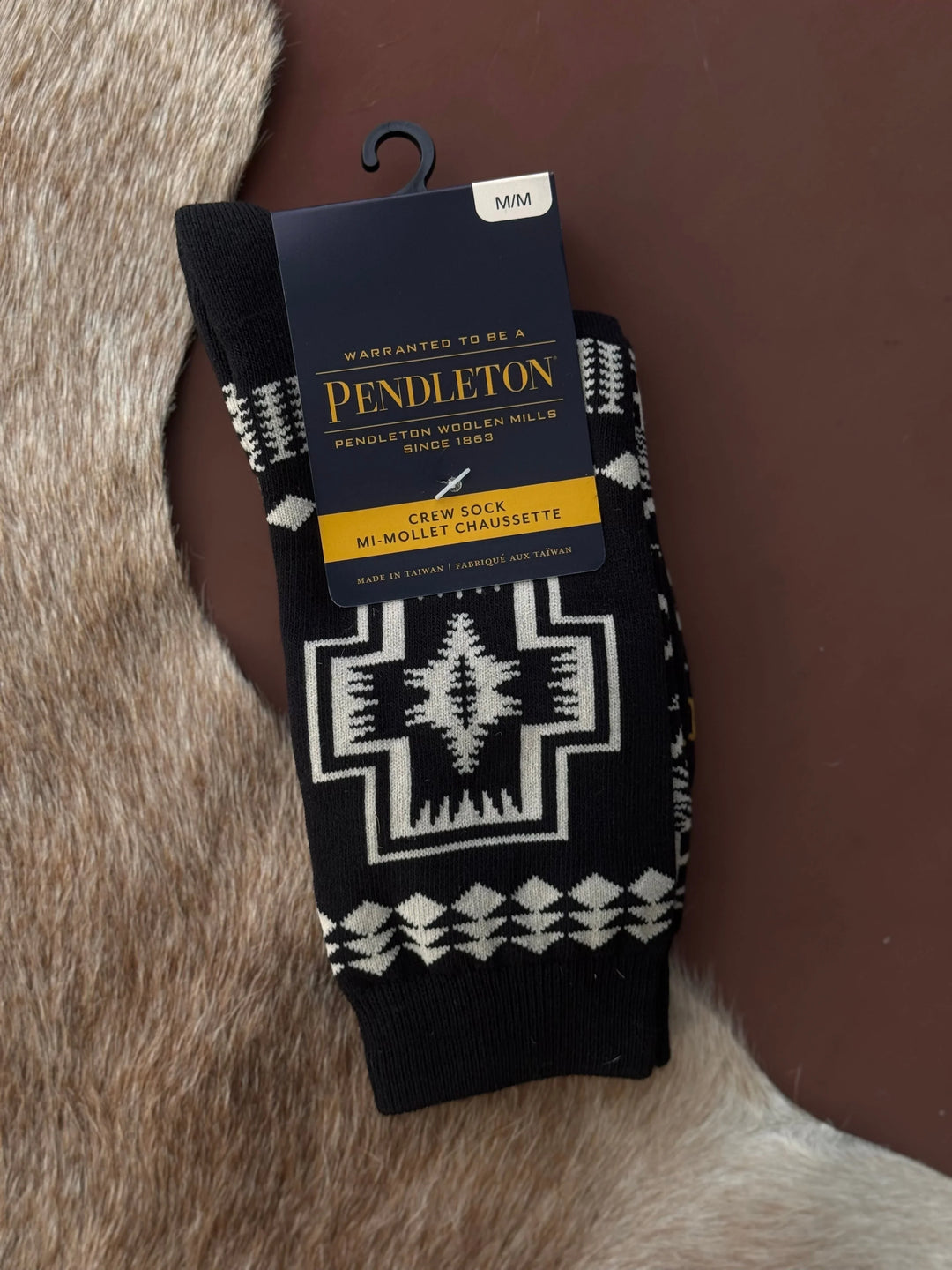Pendleton sock with packaging on a fur surface