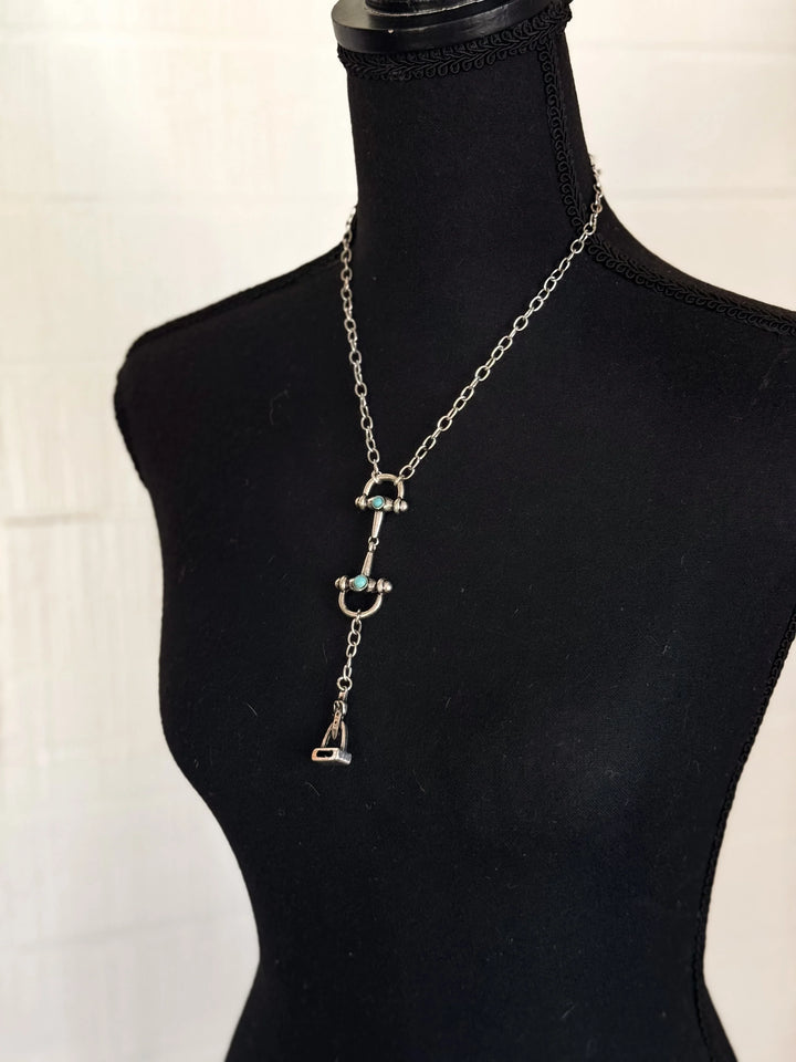 Necklace with pendant on a mannequin against a white background