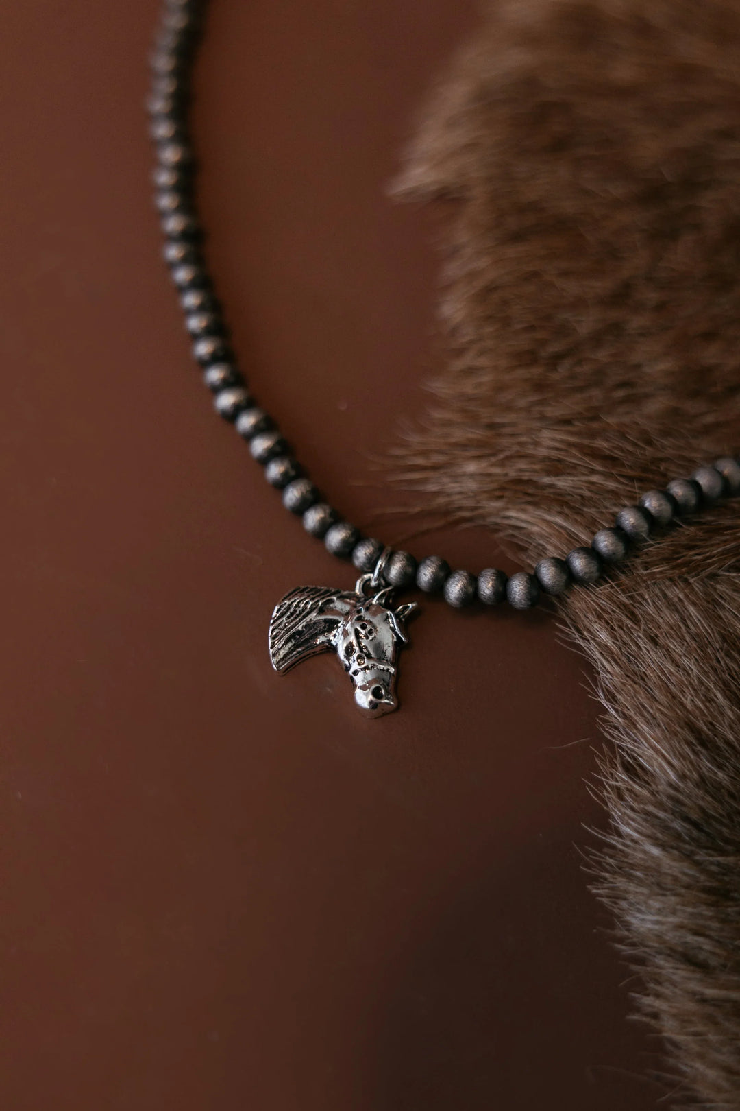 Western beaded horse charm necklace close-up